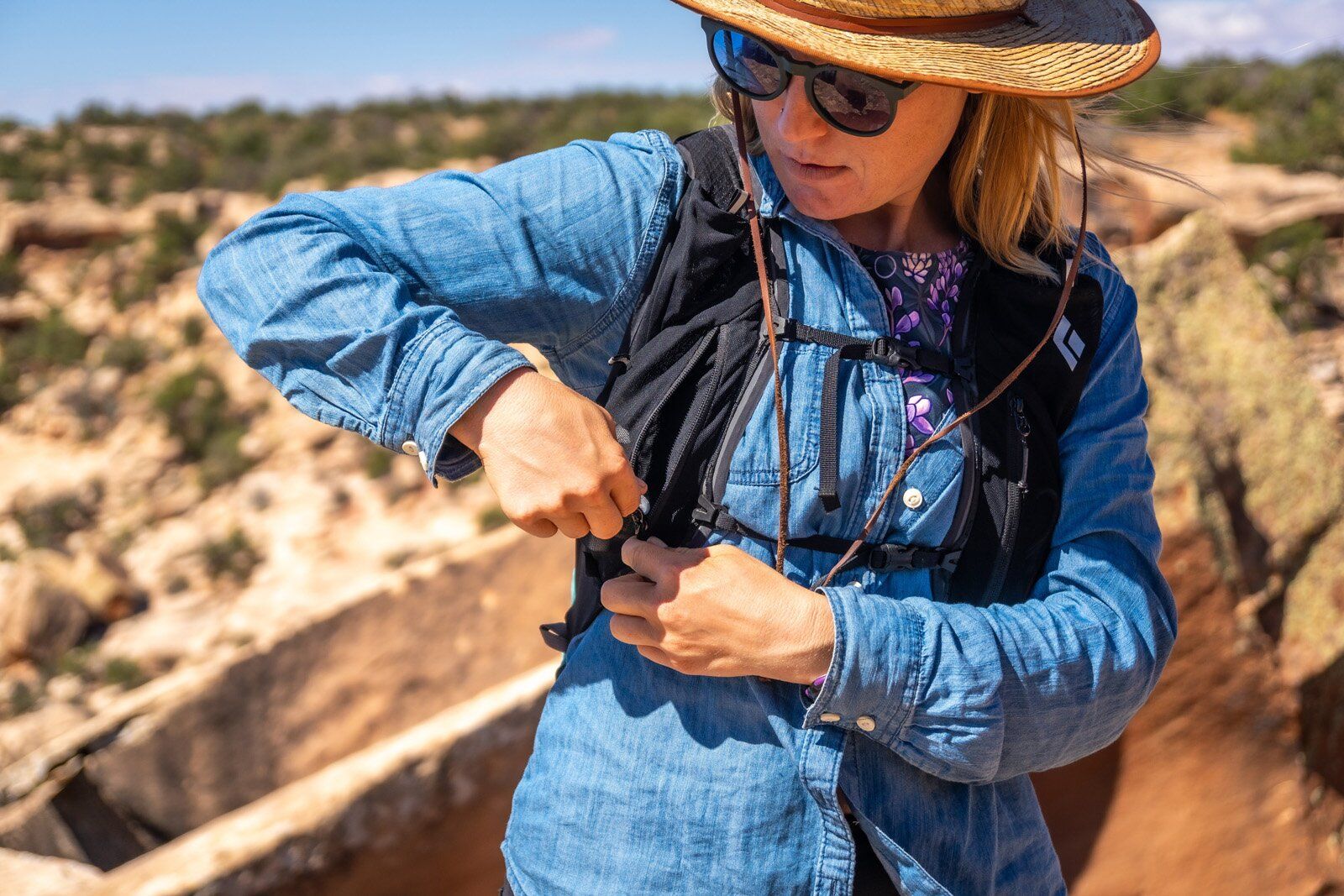 Accessing zipper strap pocket of Black Diamond Distance 22 hiking daypack