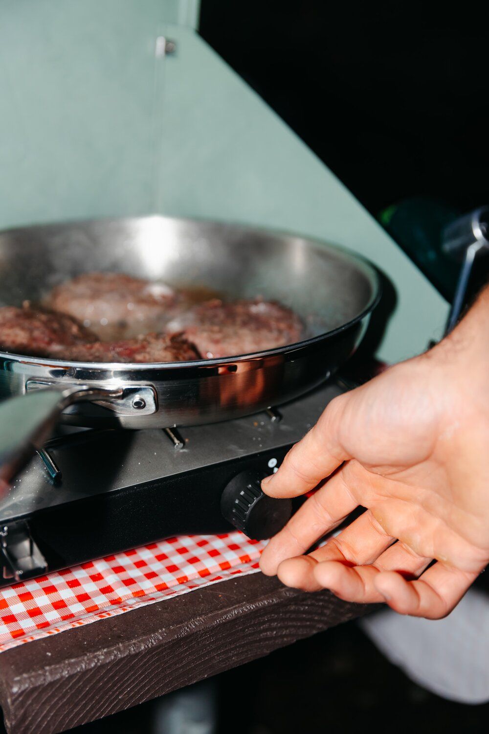 Adjusting flame on the Coleman Cascade Classic camping stove