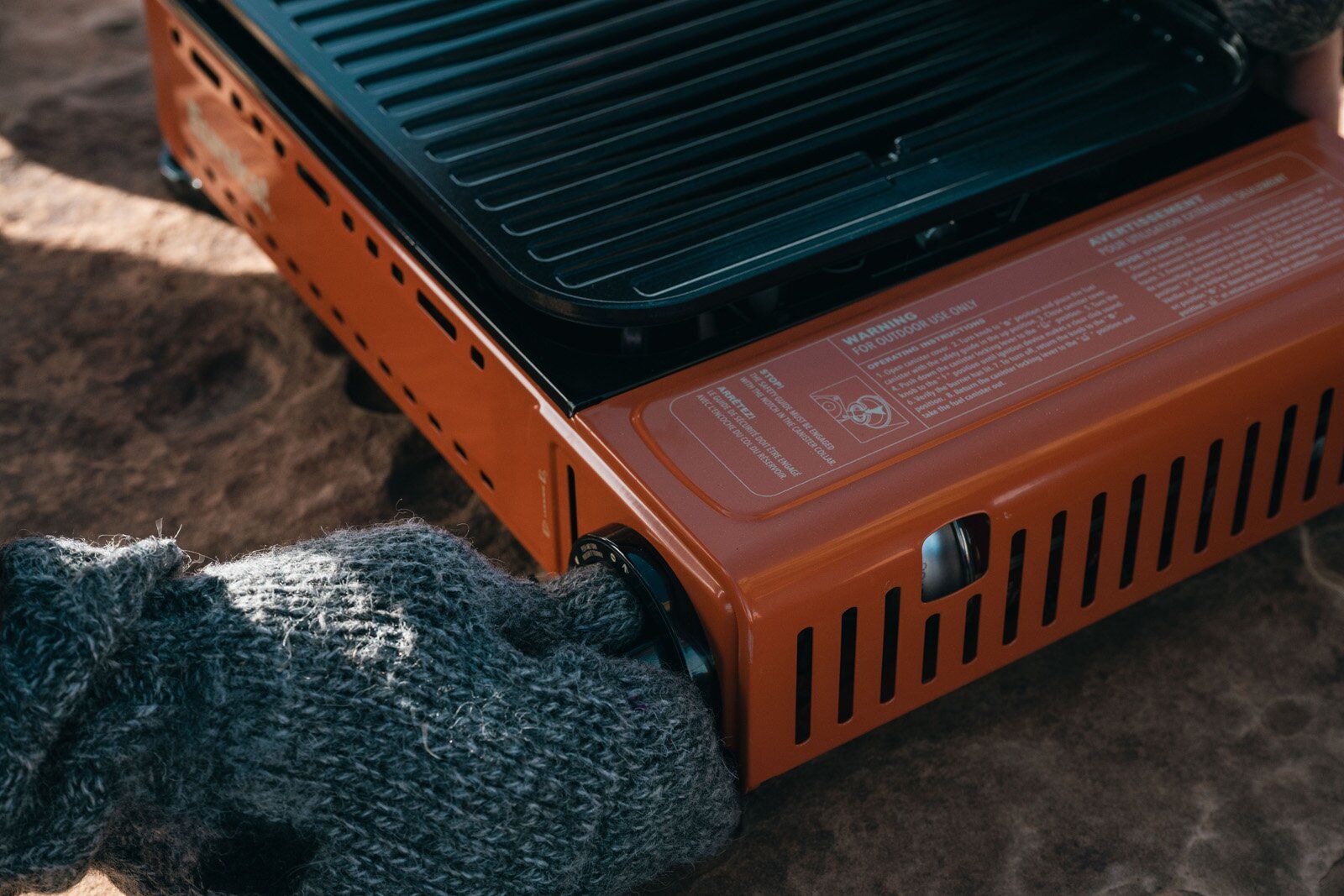 Adjusting the burner knob on the Eureka SPRK camping stove