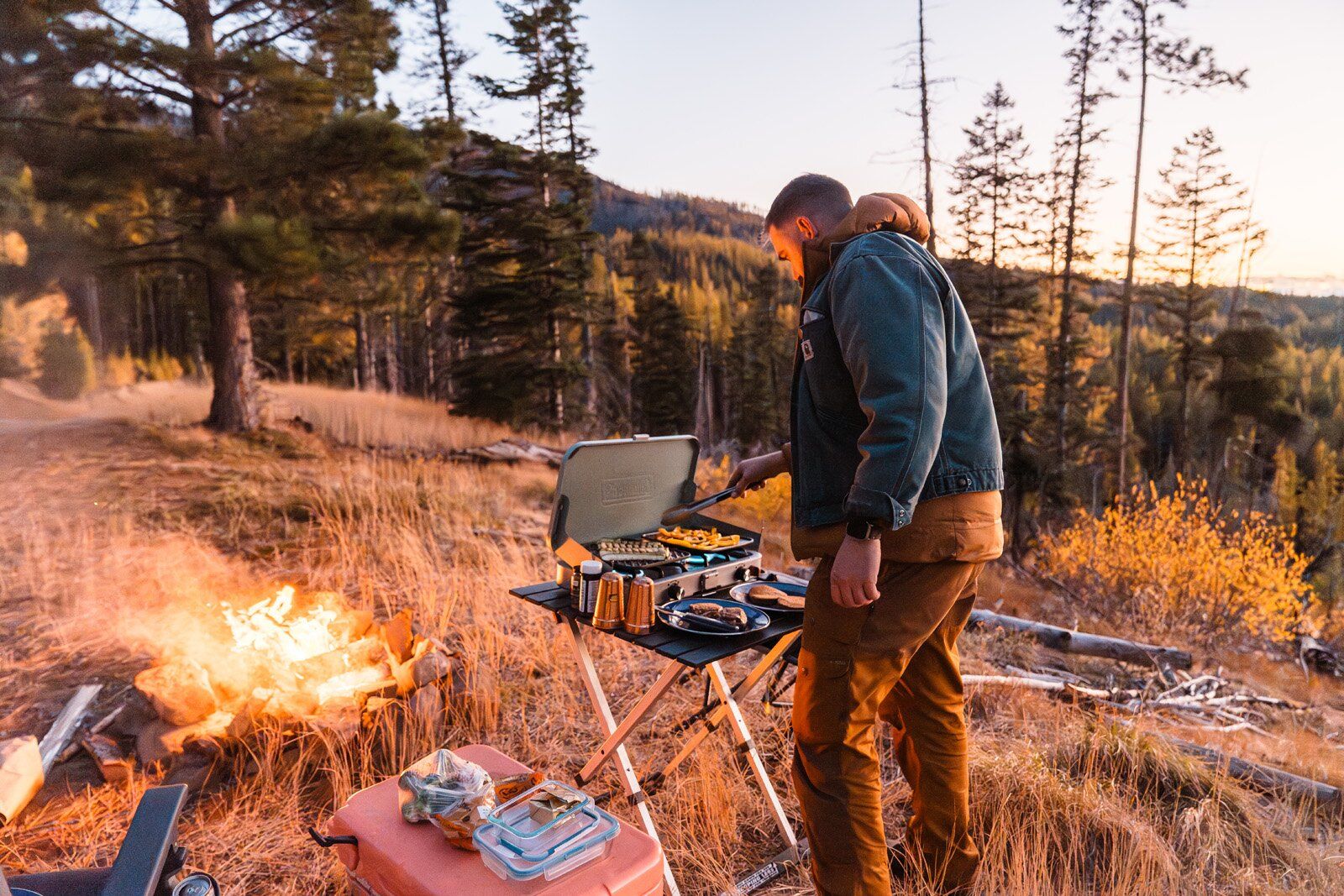 Camper cooking on the Coleman Cascade 3-in-1 camping stove