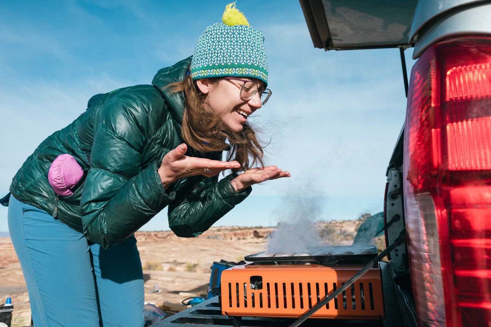 Camper smelling bacon cooking on the Eureka SPRK camping stove