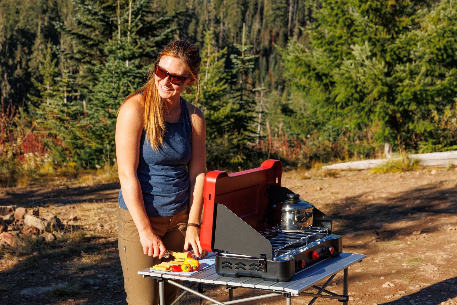 Chopping veggies next to the Camp Chef Everest 2X camping stove