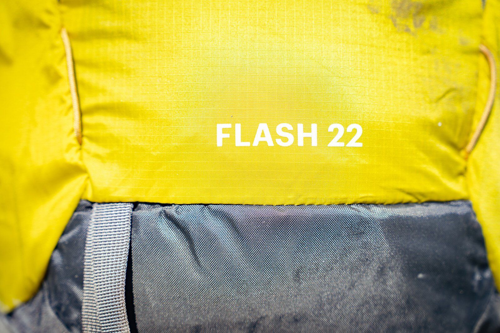 Close-up of product name of REI Co-op Flash 22 hiking daypack