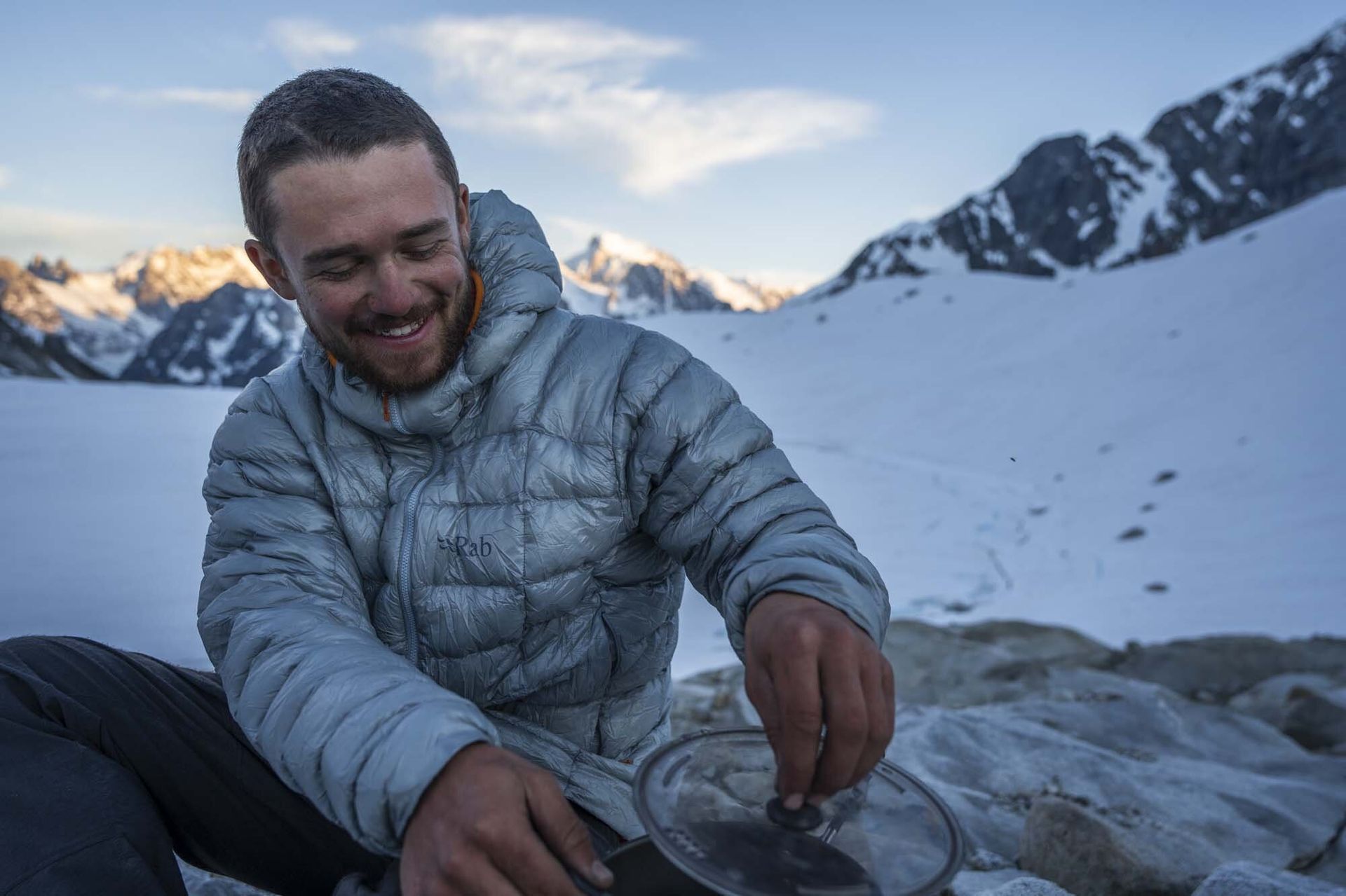 cooking dinner in Rab Mythic G Down Jacket