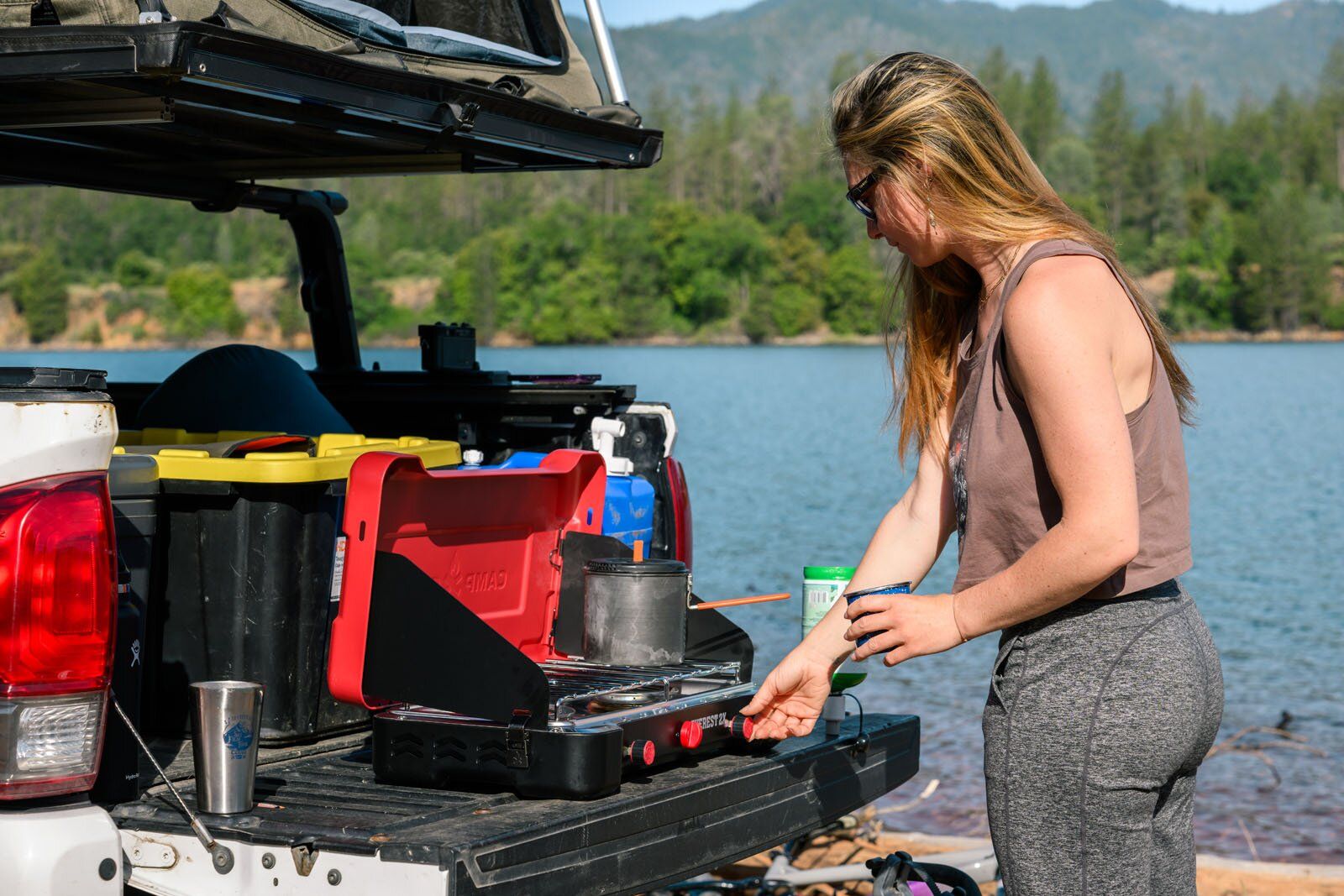 Cooking in back of truck on Camp Chef Everest 2X camping stove