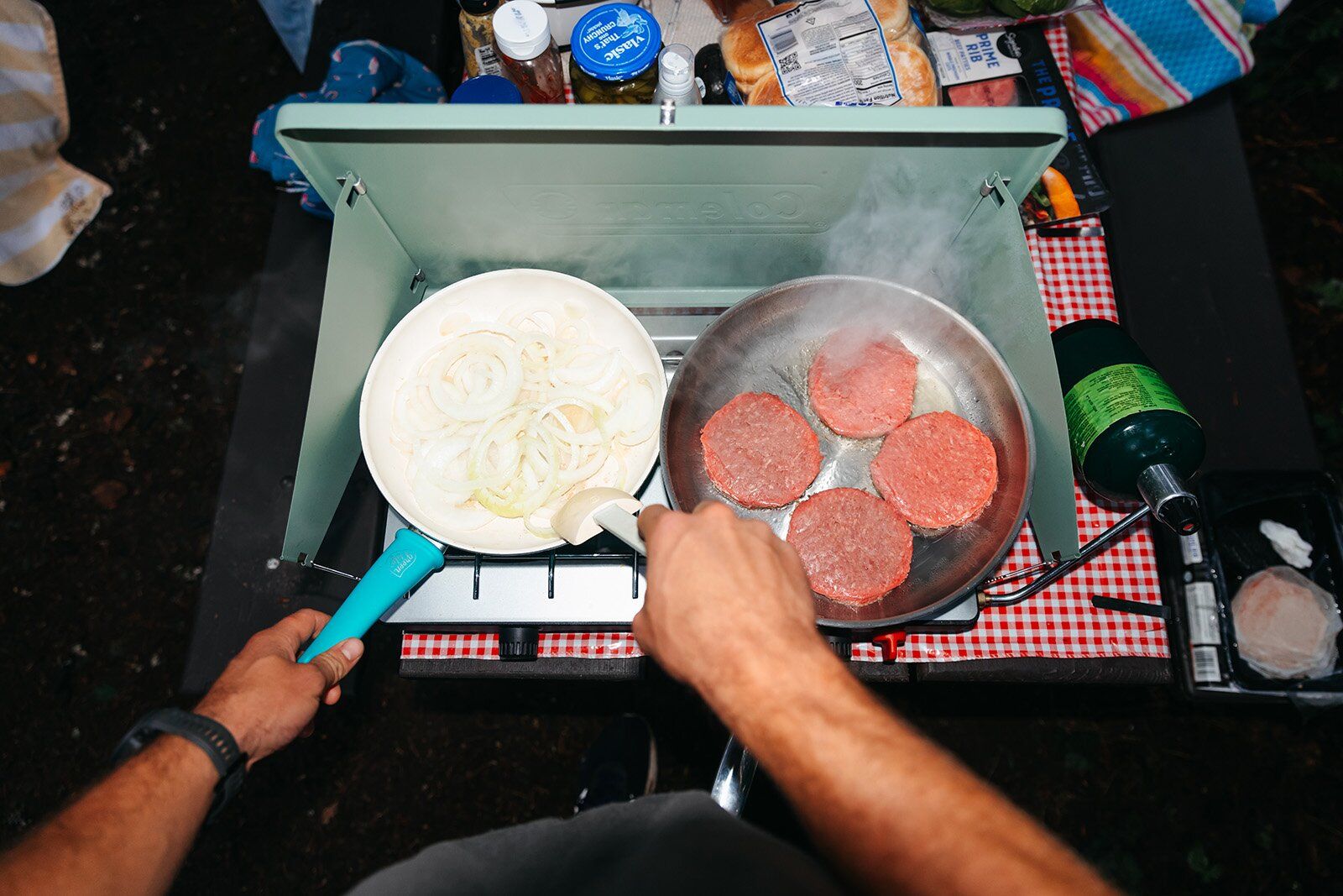 Cooking onions and burgers on the Coleman Cascade Classic camping stove