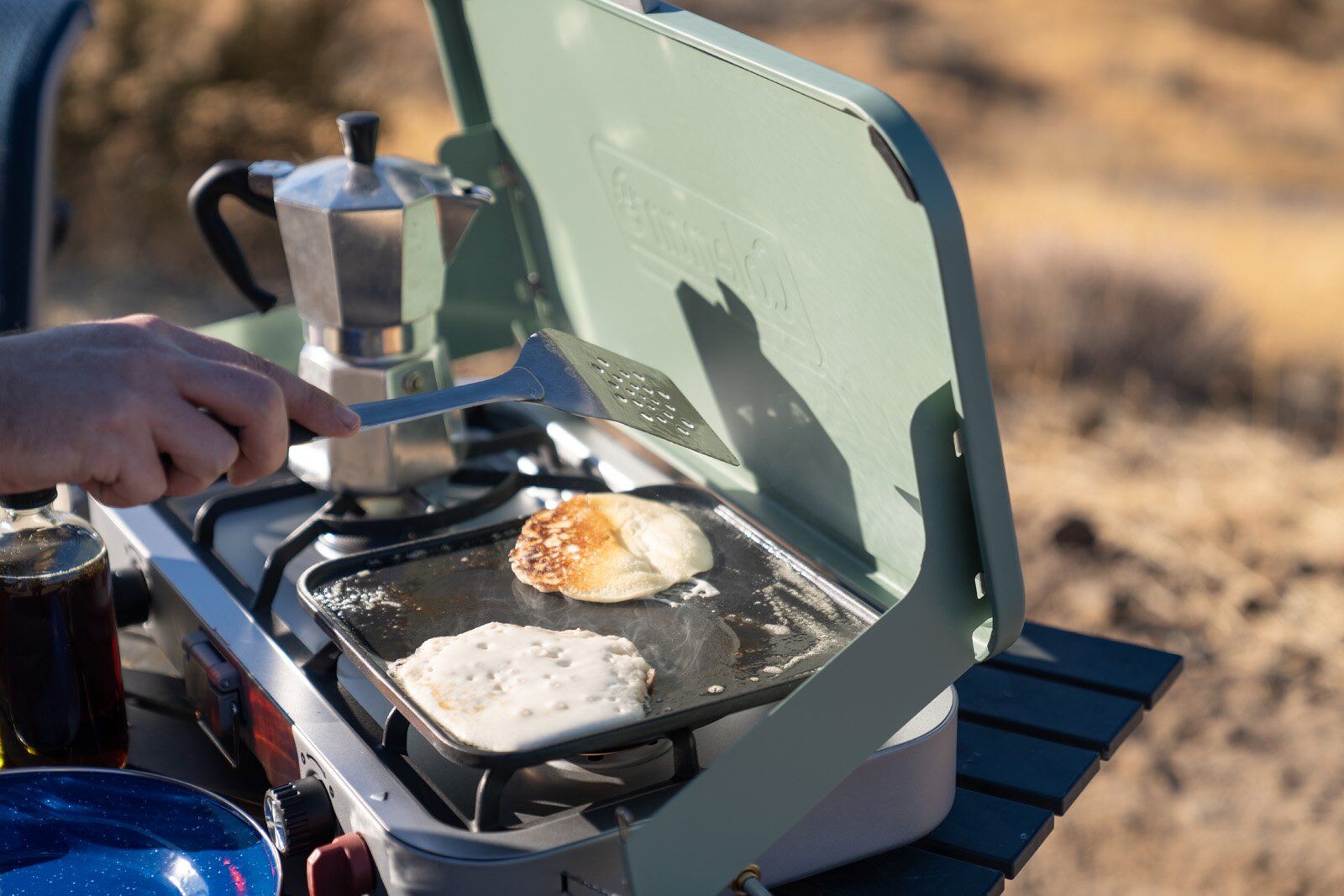 Cooking pancakes on the Coleman Cascade 3-in-1 camping stove griddle