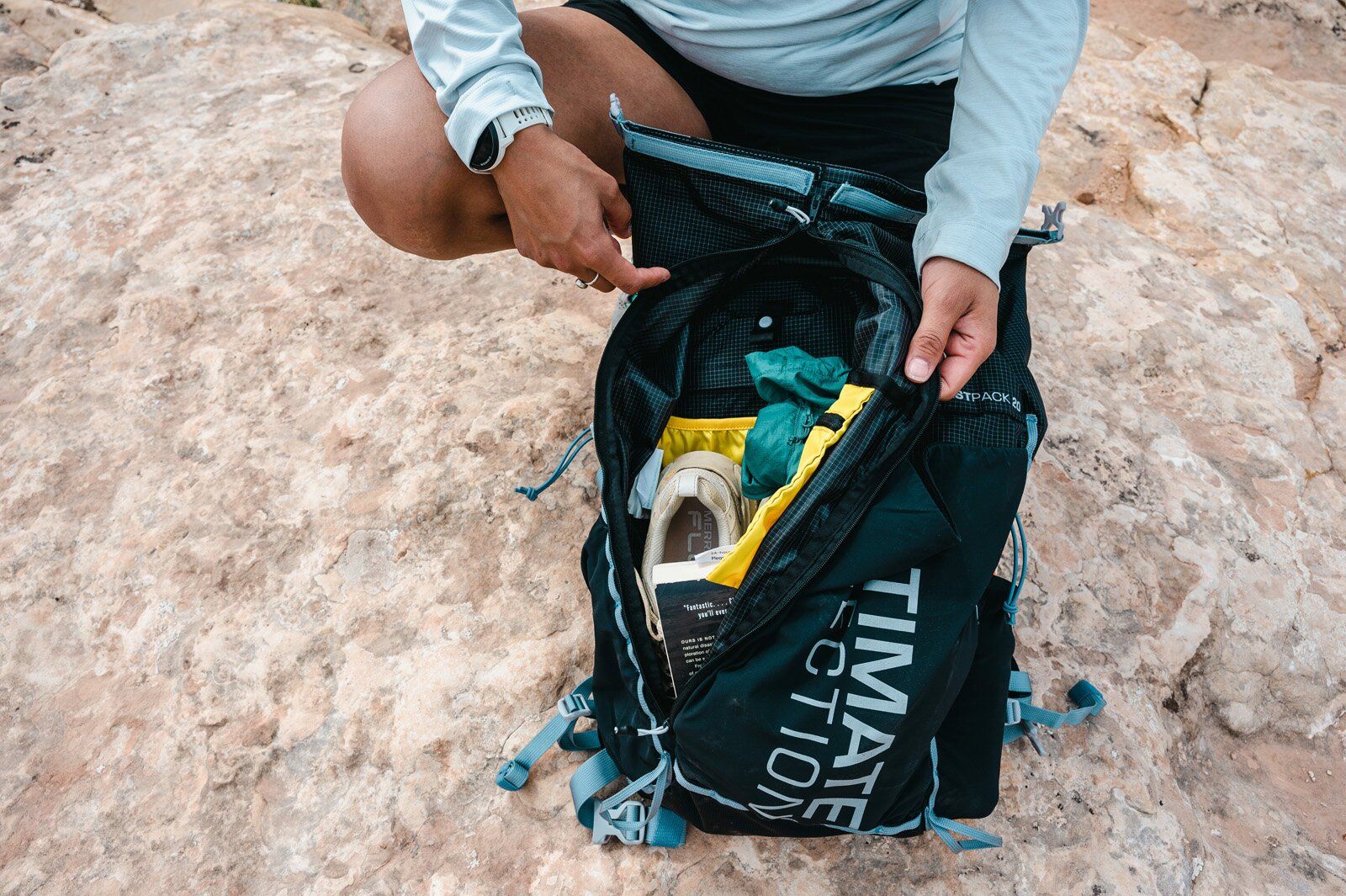 Gear accessed through zip-down main compartment of Ultimate Direction Fastpack 20 hiking daypack