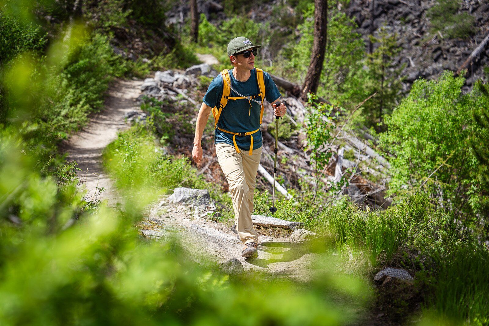 Hiking on trail with the REI Co-op Trail 25 hiking daypack