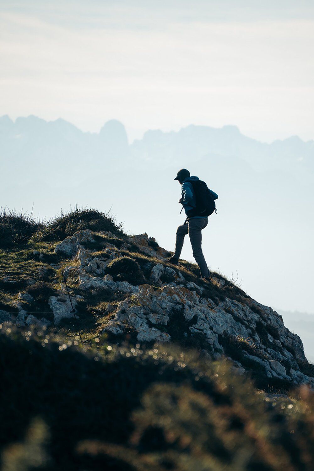 Hiking over rocks wearing the Osprey Talon 22 hiking daypack