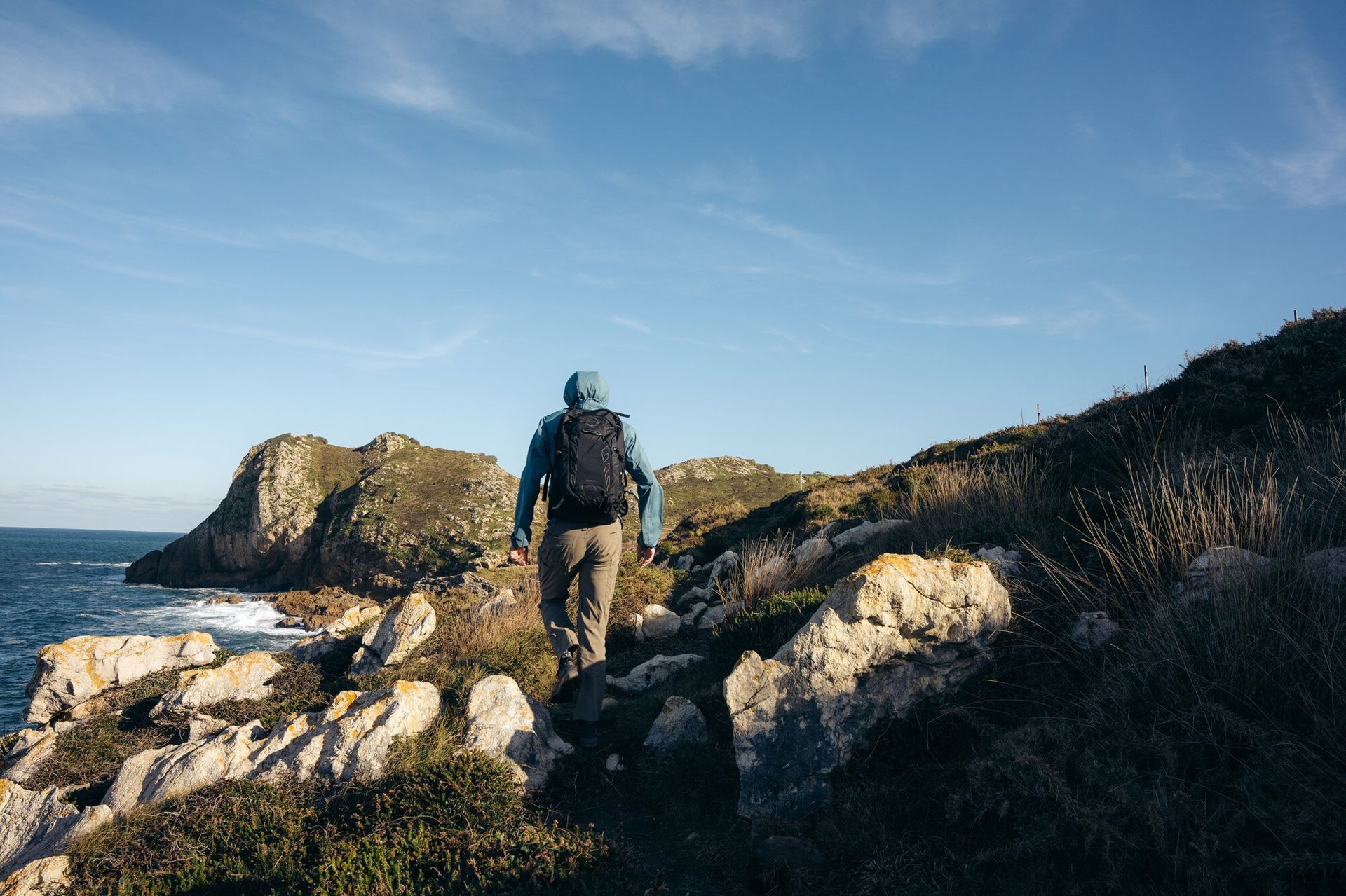Hiking through coastal trails wearing the Osprey Talon 22 hiking daypack