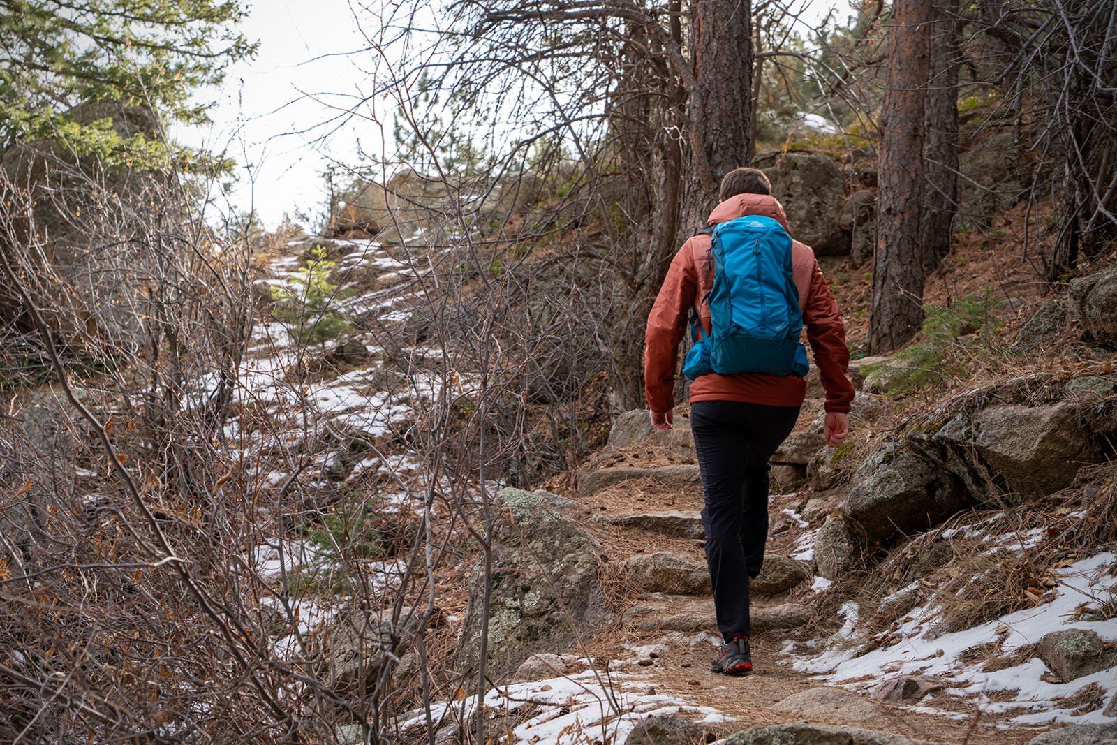 Hiking up snowy steps with Gregory Zulu 24 LT hiking daypack