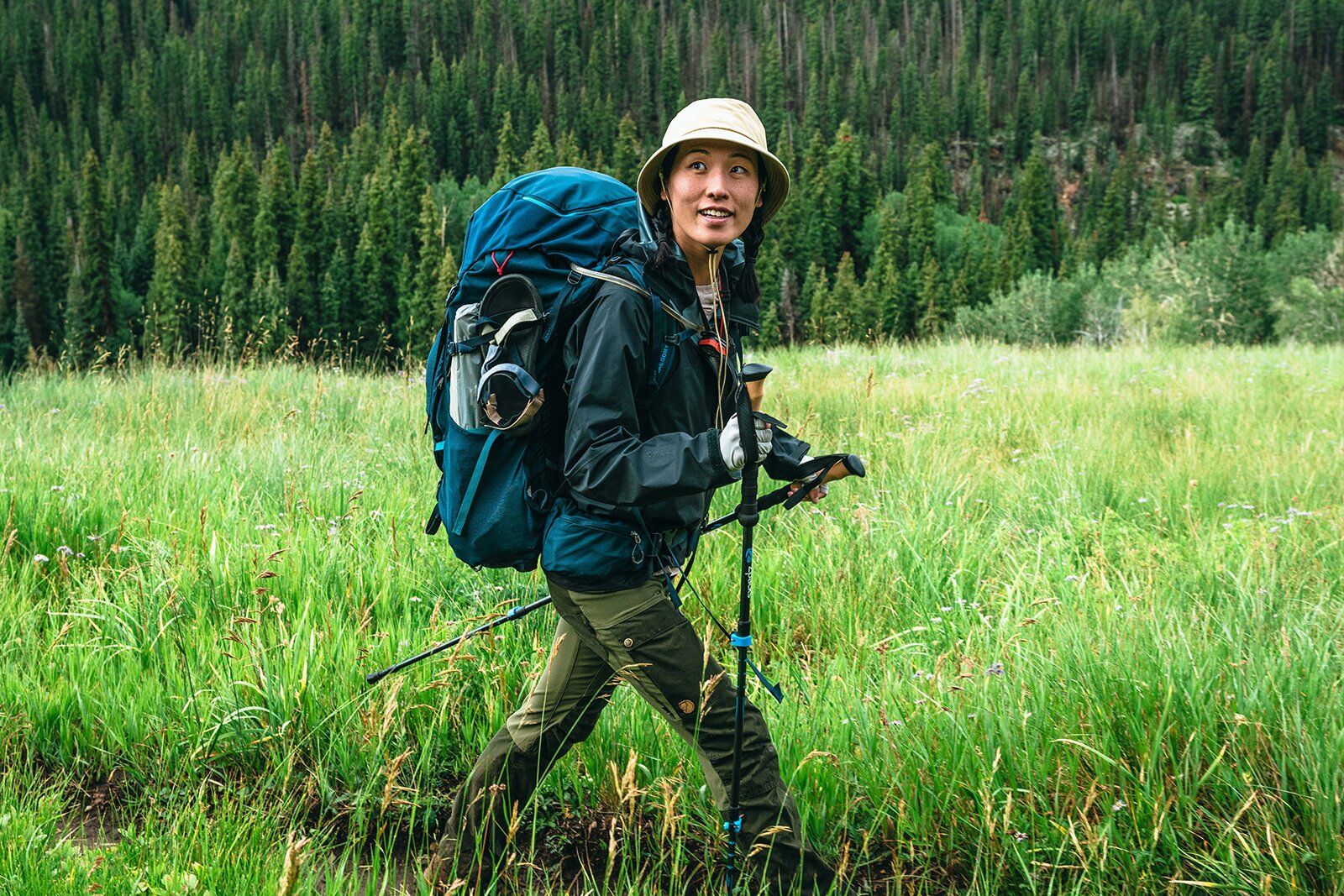 Jade hiking on trail with Zpacks Carbon Fiber trekking poles