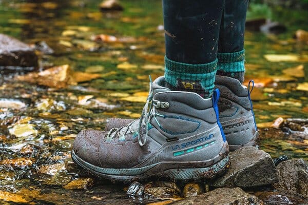 La Sportiva TX Hike Leather Hiking Boot's side profileLa Sportiva TX Hike Mid Leather GTX hiking boot close up standing in stream
