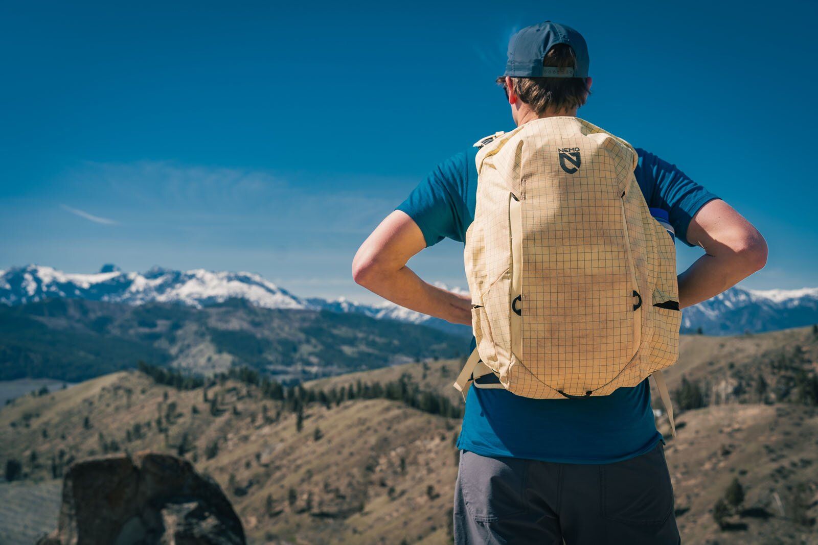 Looking at mountains wearing Nemo Resolve Endless Promise 25 daypack