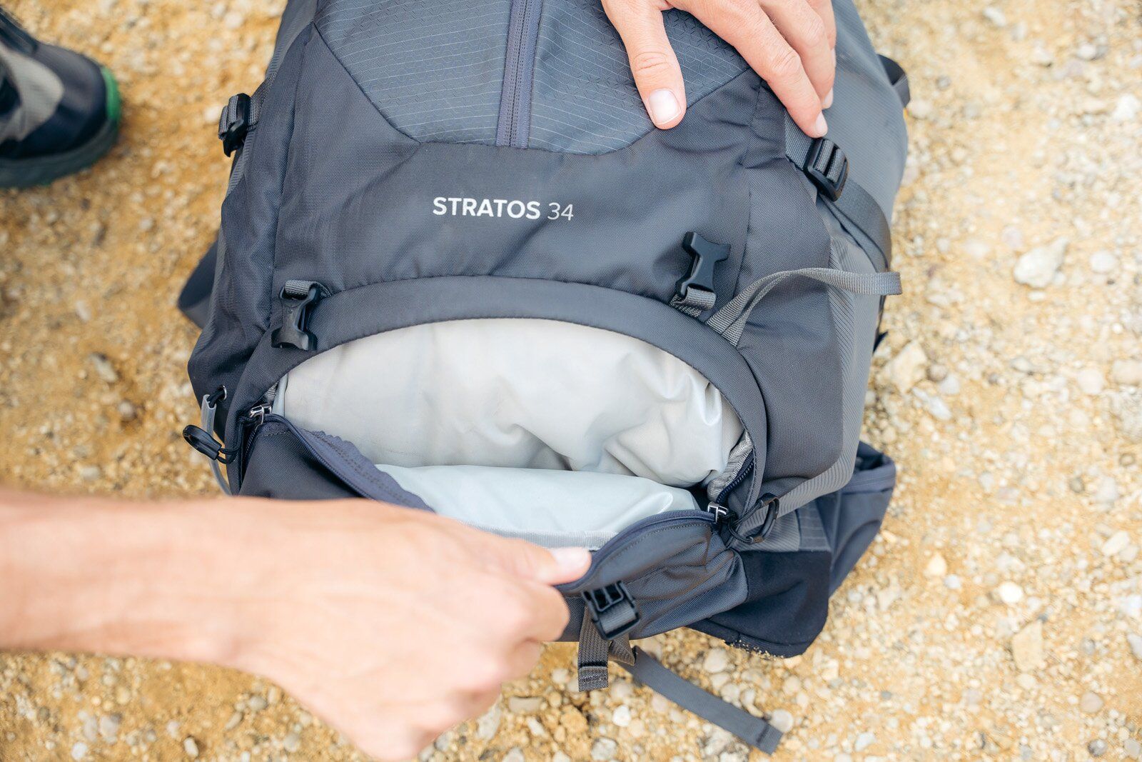 Osprey Stratos 34 hiking daypack bottom of pack zippered storage pocket