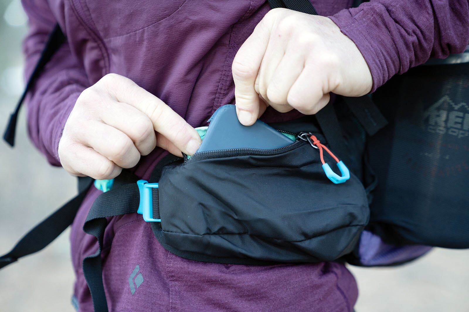 Phone in hipbelt pocket of Gregory Maya 20 hiking daypack