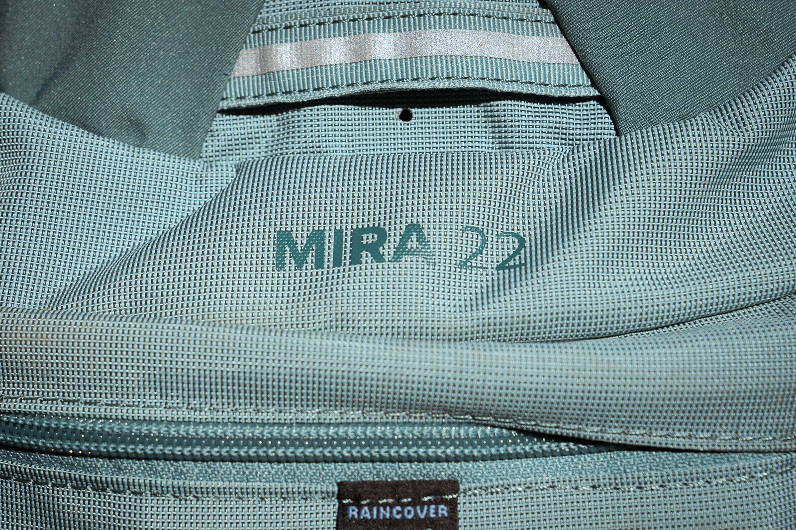 Product name close-up of Osprey Mira 22 hiking daypack