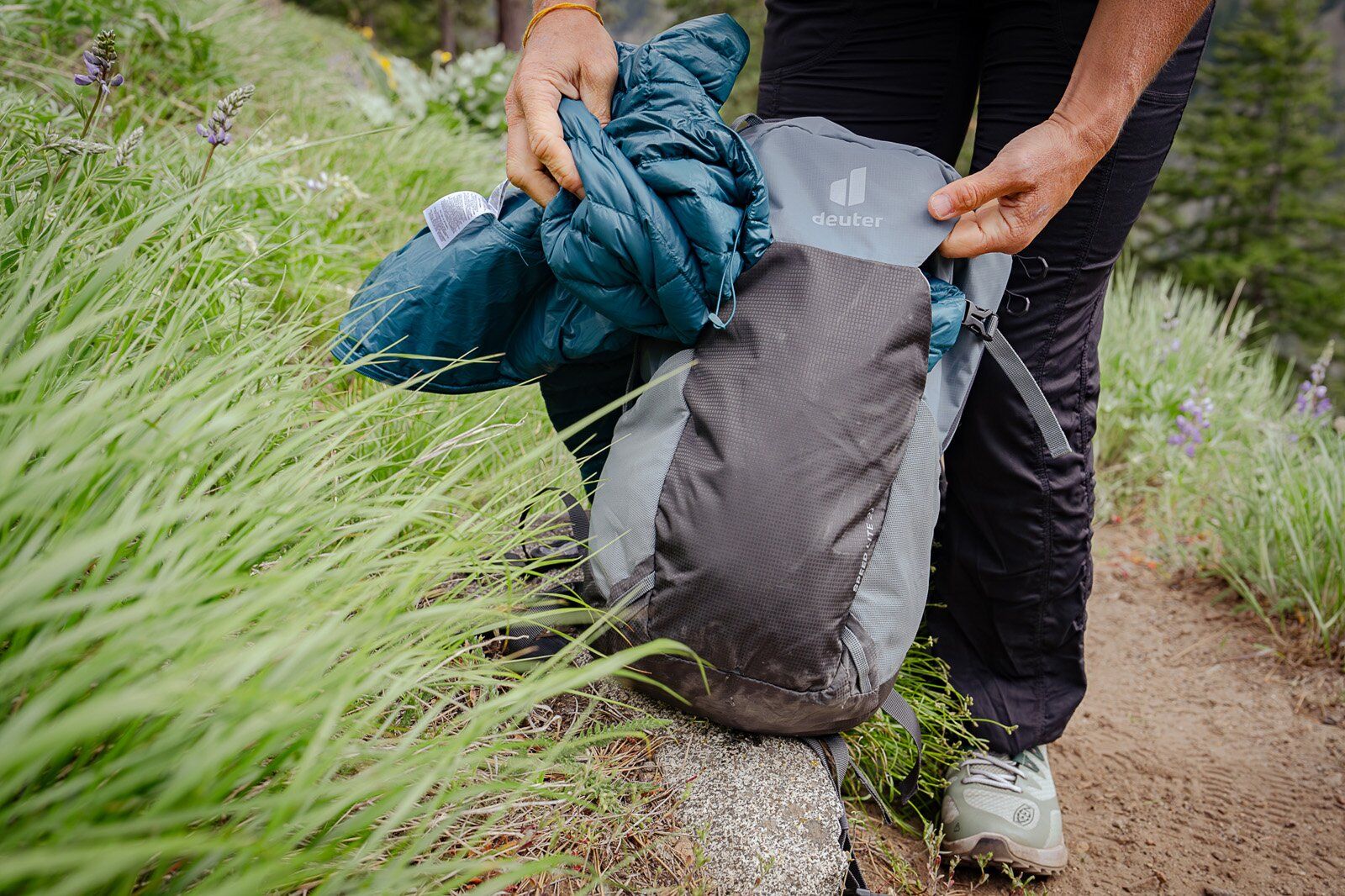 Pulling jacket out of Deuter Speed Lite 21 hiking daypack