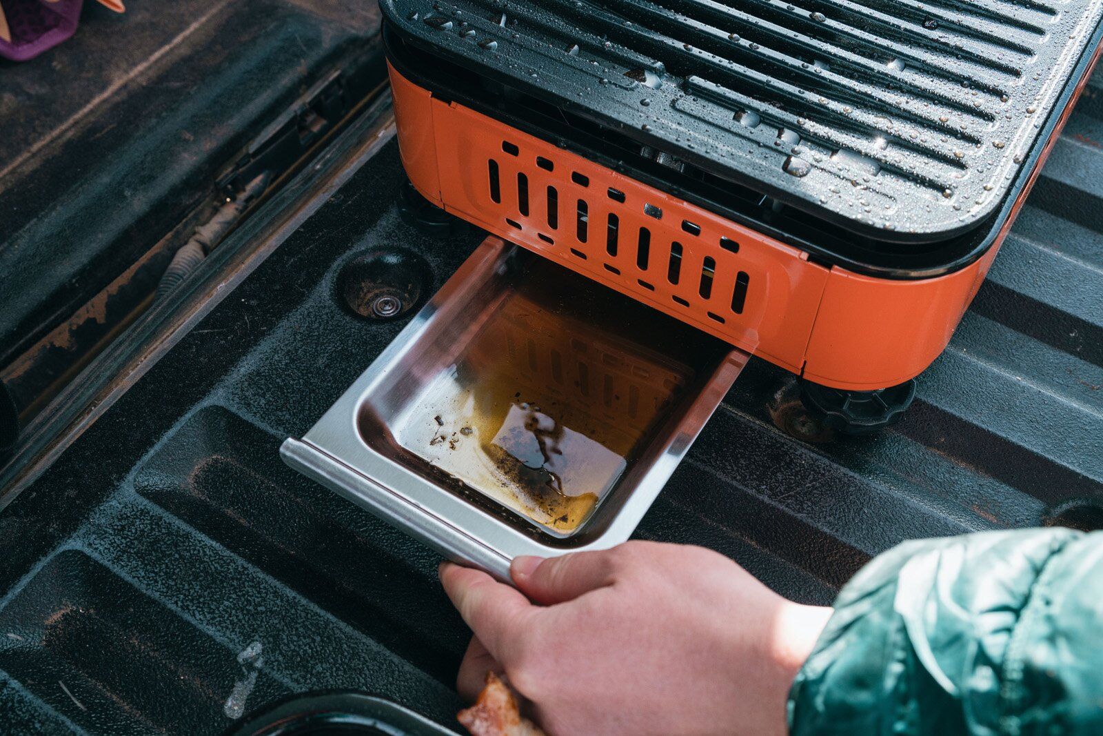 Pulling out drip tray from the Eureka SPRK camping stove