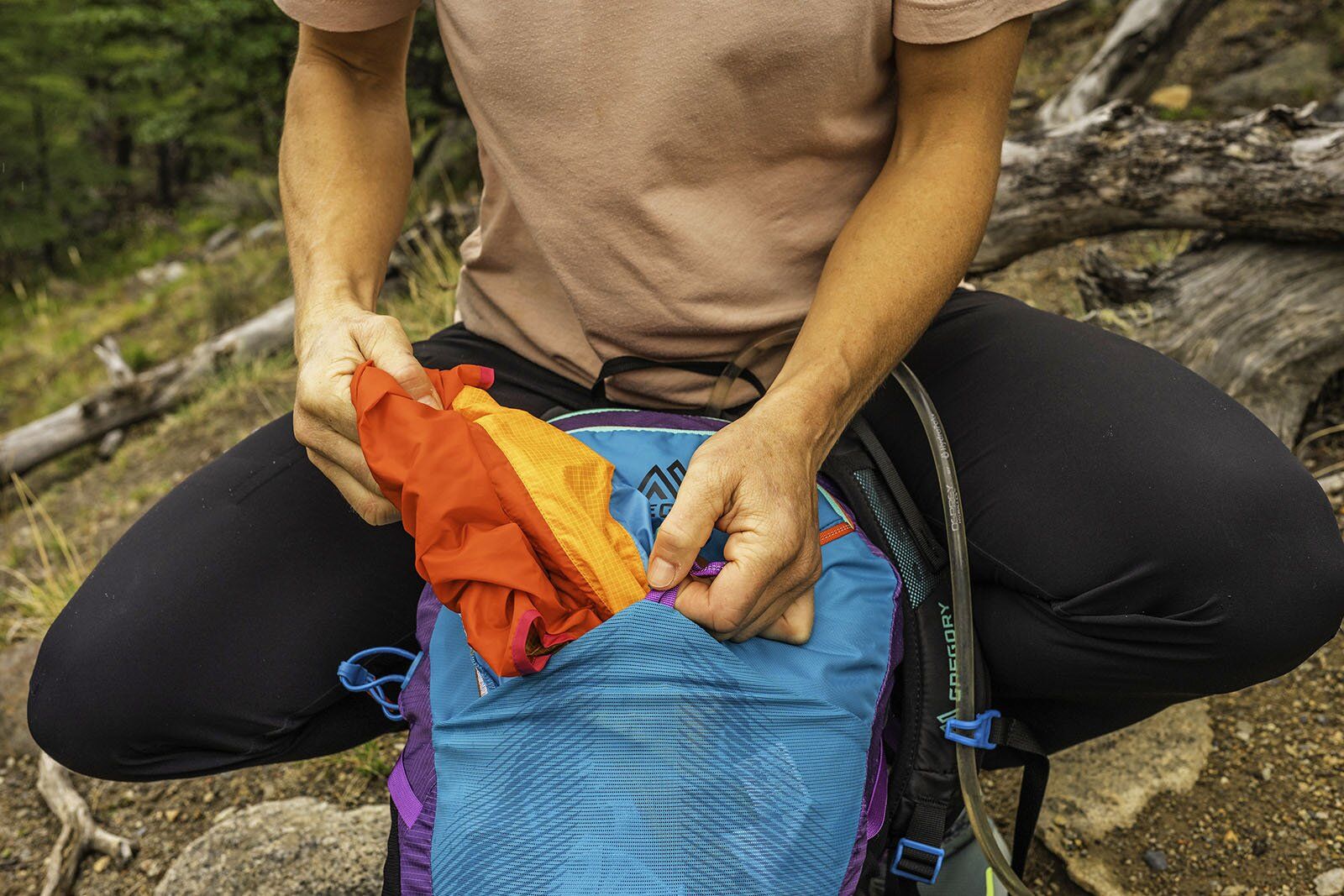 Pulling wind jacket out of Gregory Maya 20 daypack