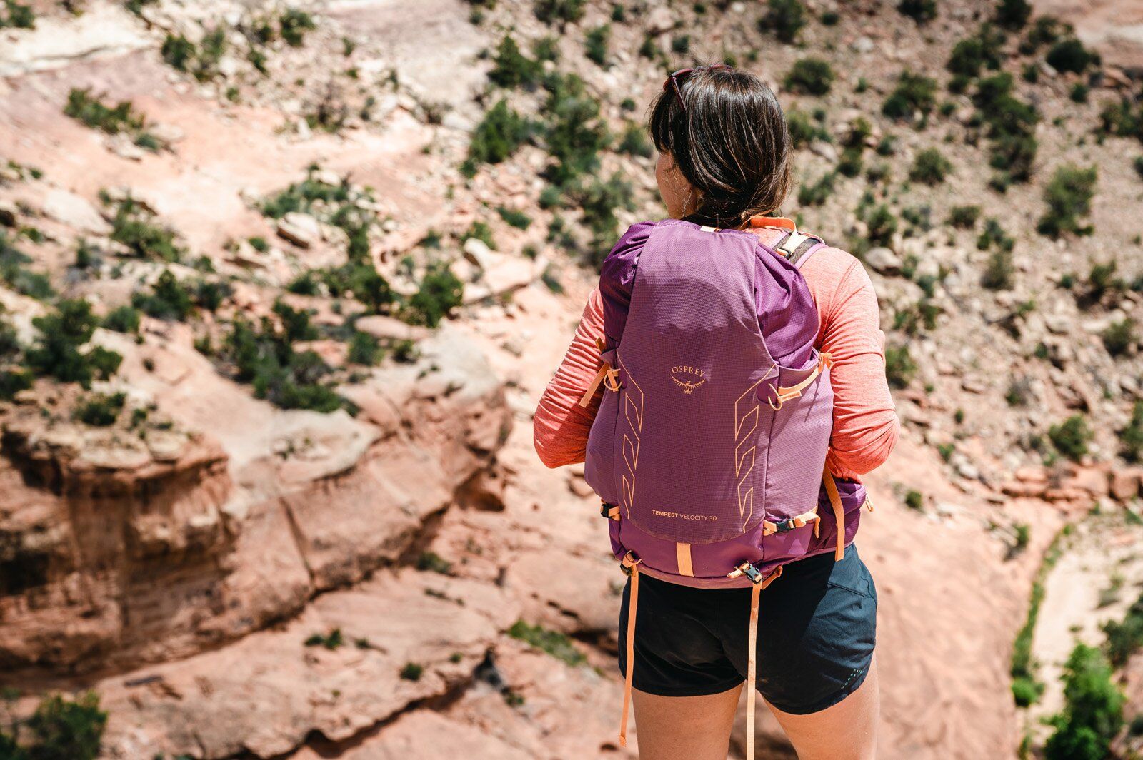 Rear view of hiker with Osprey Tempest Velocity 30 hiking daypack