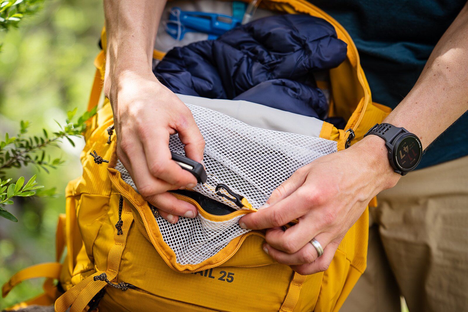 REI Co-op Trail 25 hiking daypack zip pocket for keys