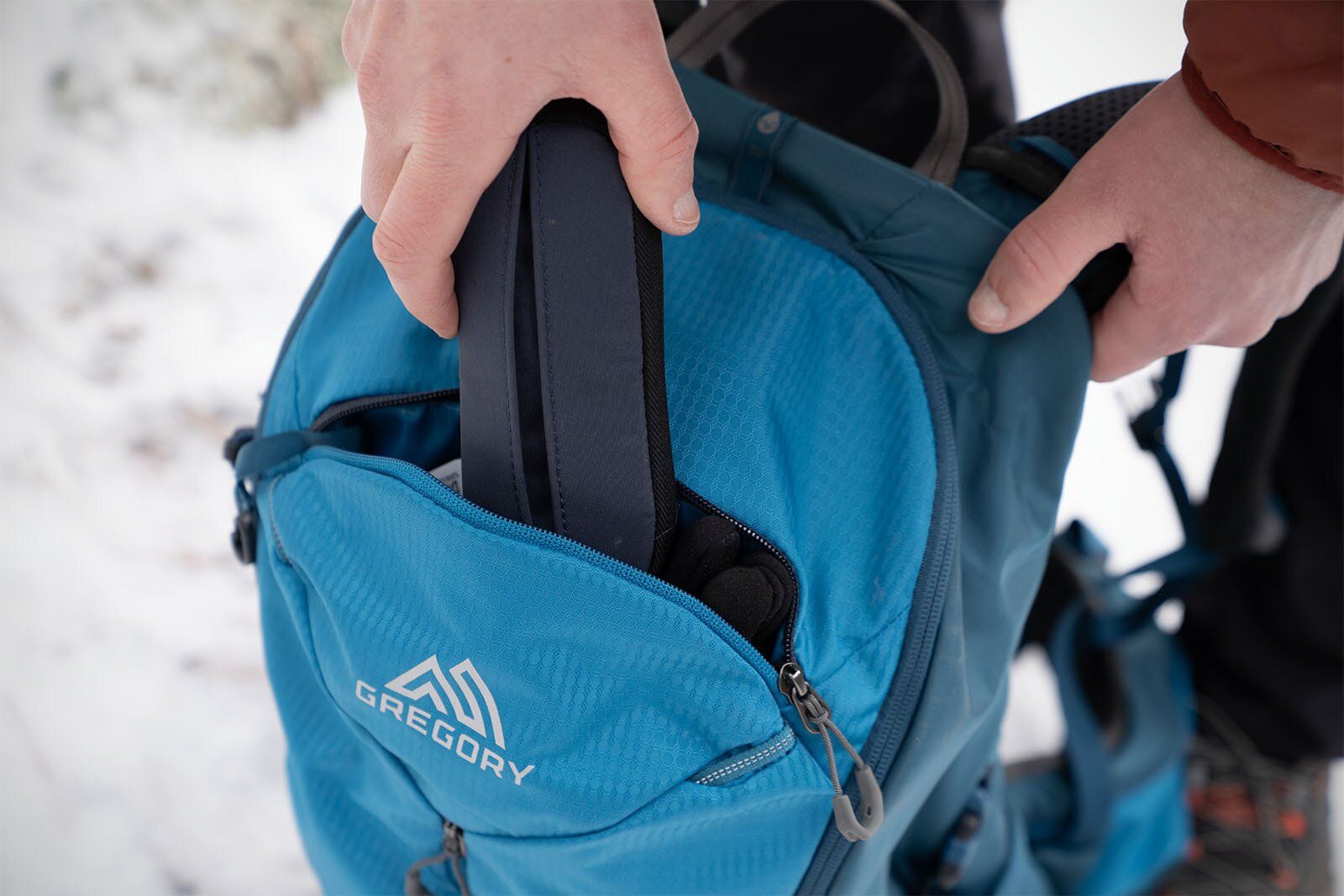 Removing sunglasses case from top pocket of Gregory Zulu 24 LT hiking daypack