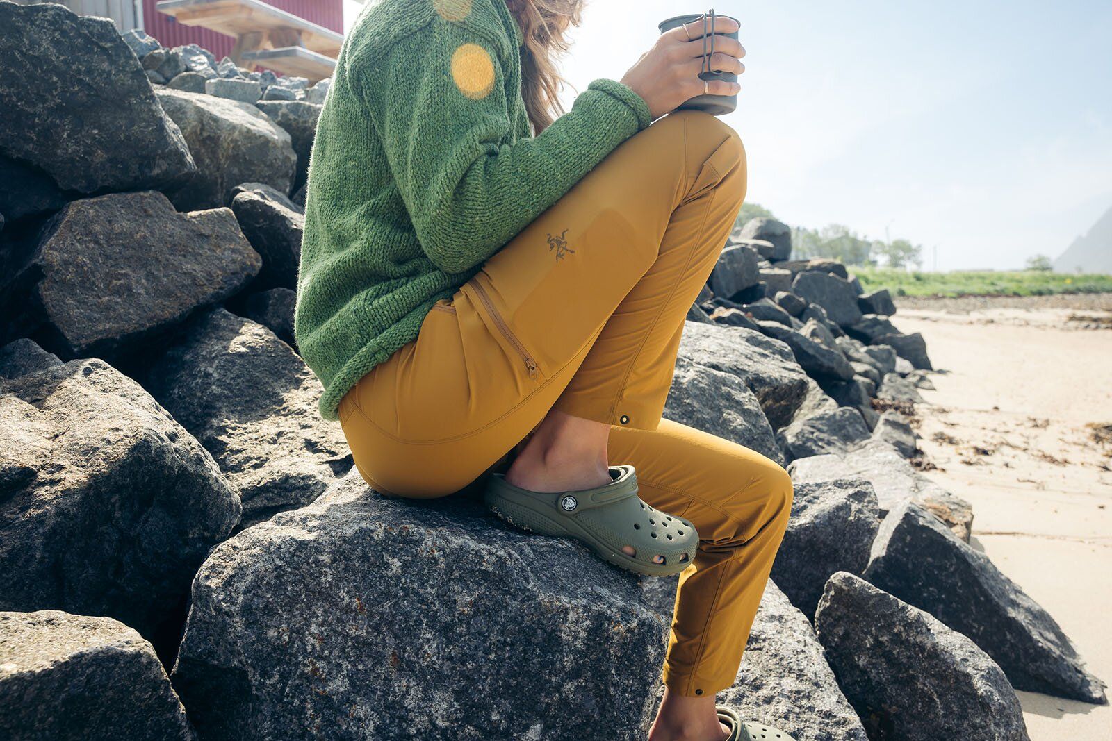 Sitting on rock drinking coffee with Arc'teryx Gamma Lightweight hiking pants