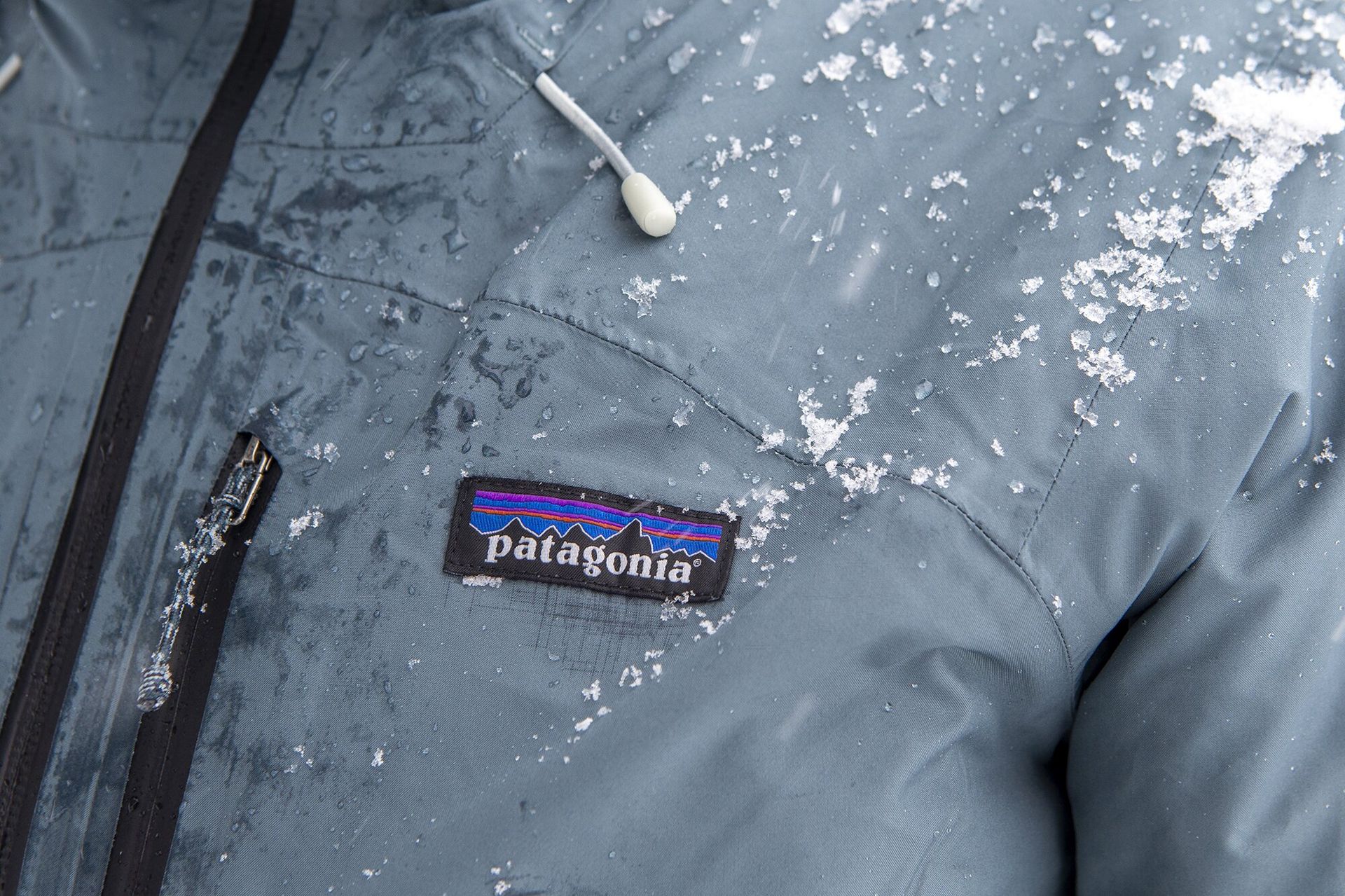 Snow and moisture accumulating on Patagonia Powder Town ski jacket