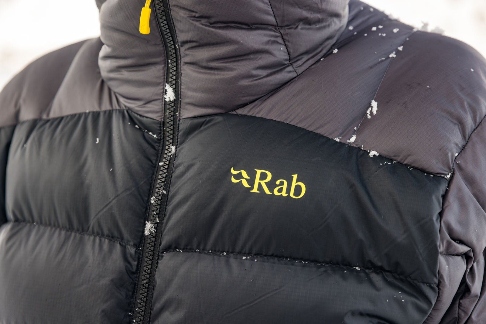 Snow on front of the Rab Neutrino Pro winter jacket