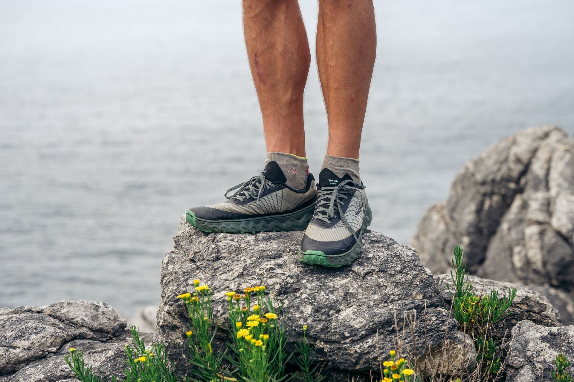 Standing on rock near water in NNORMAL TOMIR 2.0 Hiking Shoes