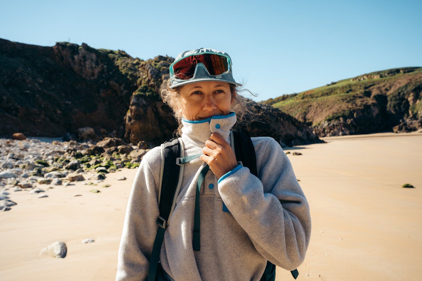 Standing on sandy beach in Patagonia Lightweight Synchilla Snap-T Pullover fleece jacket