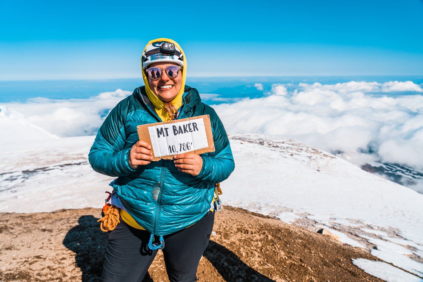 Standing on the summit of Mt. Baker wearing the women's Outdoor Research Helium Down Jacket