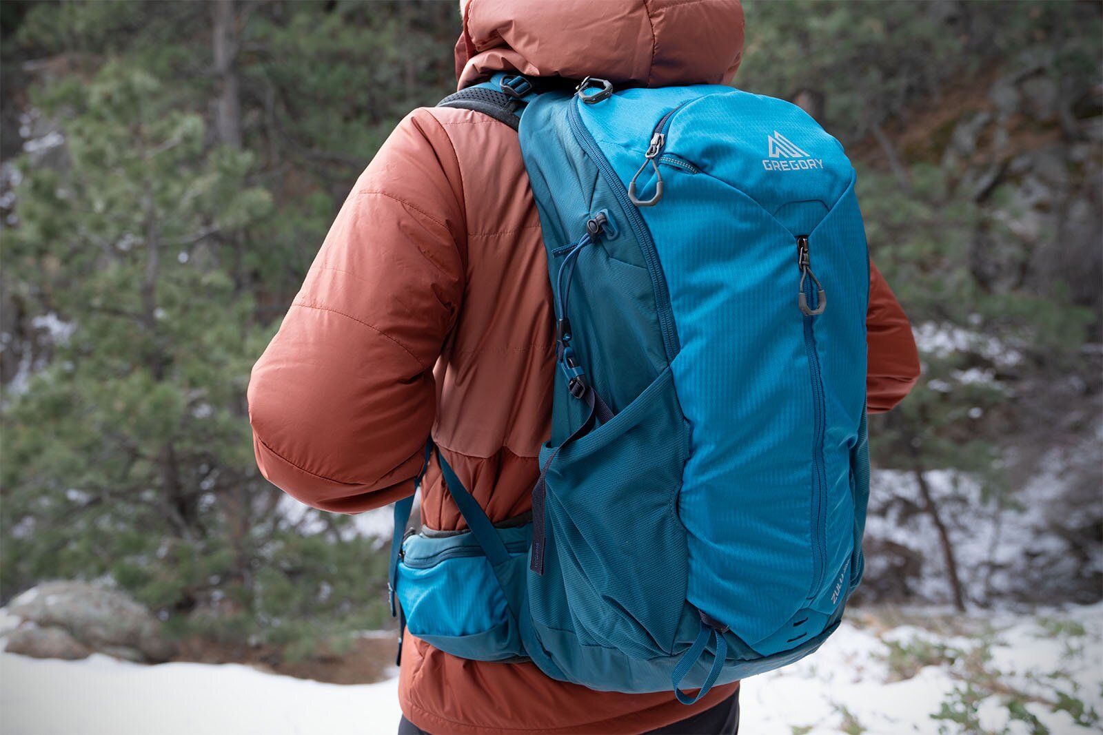 Stopped on the trail wearing Gregory Zulu 24 LT hiking daypack