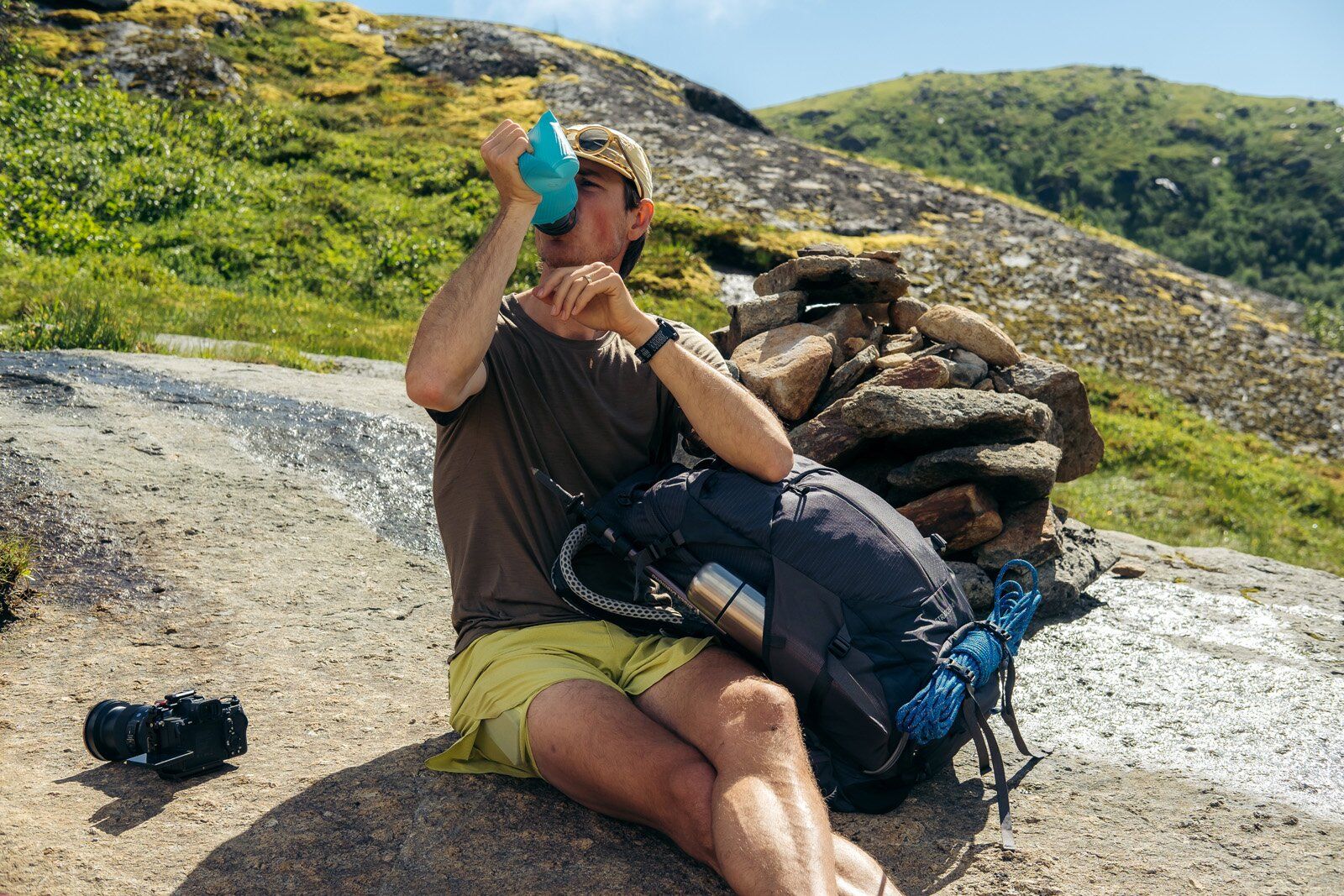 Stopping for water with Osprey Stratos 34 hiking daypack
