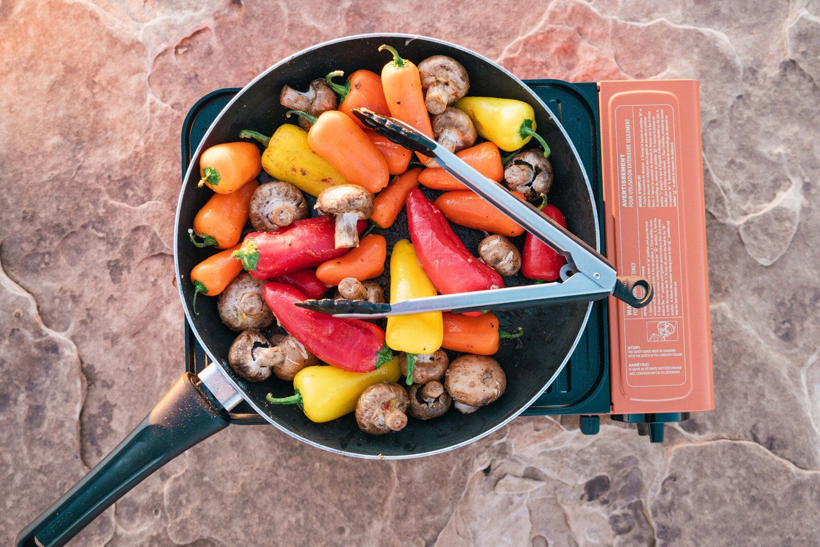 Veggies cooking in a pan on the Eureka SPRK camping stove